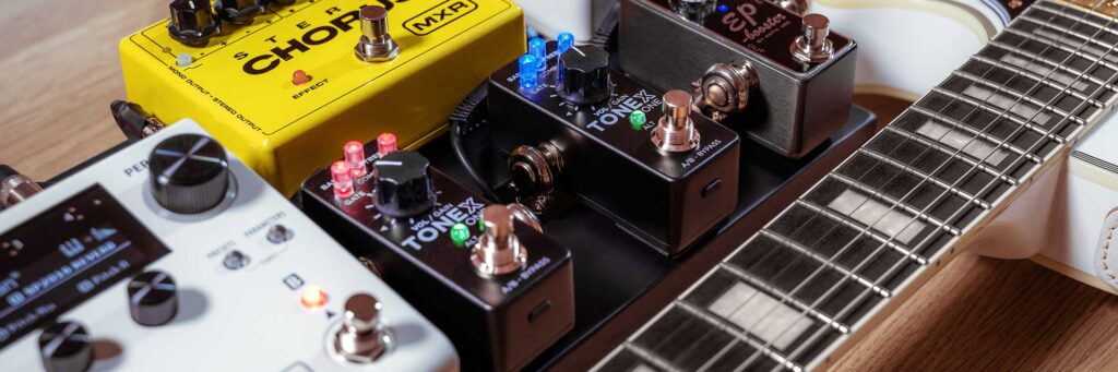 IK Multimedia ToneX One pedal on a pedalboard alongside other effects, including an MXR Stereo Chorus and EP Booster.